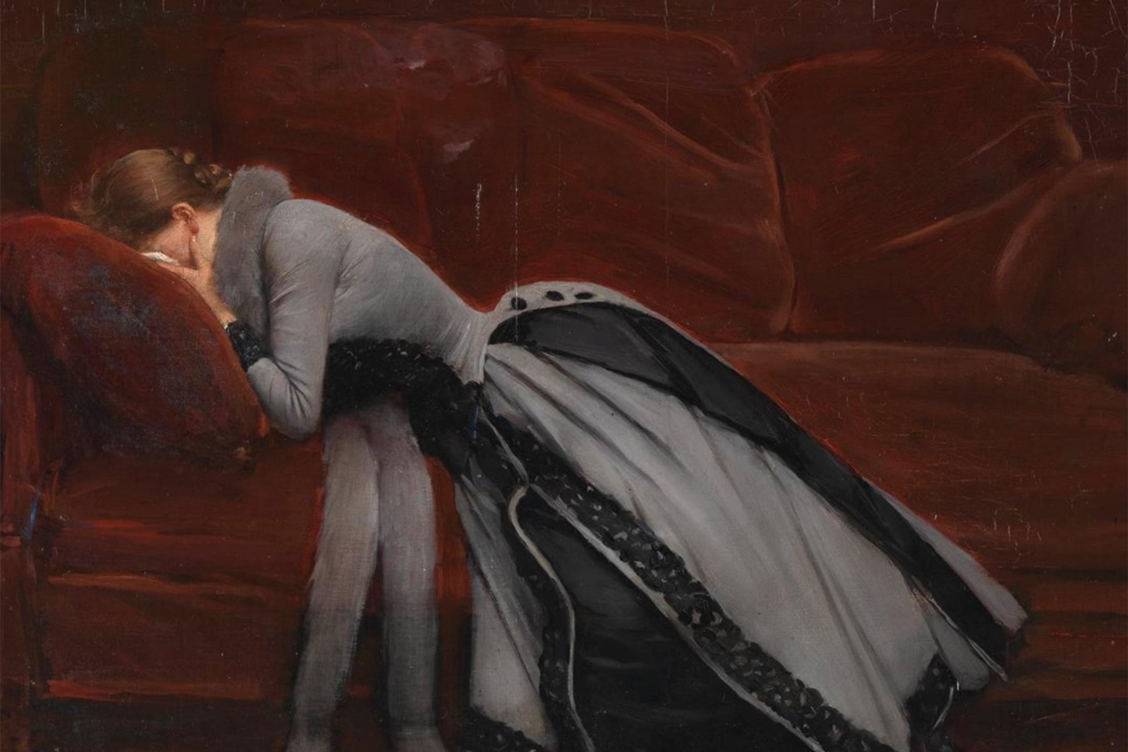 Painting of a woman in a grey dress leaning on a red sofa, her face buried in her hands, evoking a sense of sorrow.